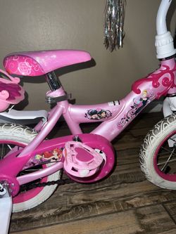 Huffy princess bike with doll online carrier