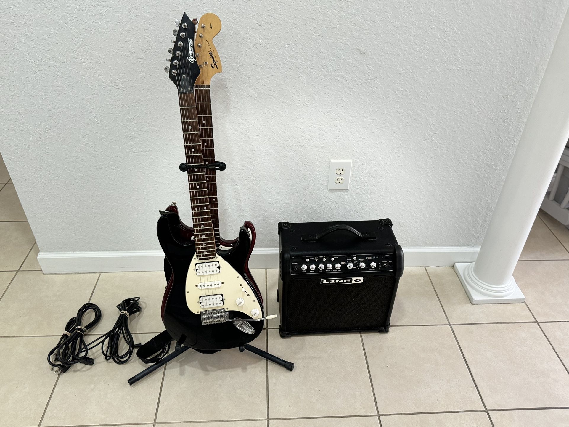 Two electric guitars. One Brownsville and Squier, plus Amplifier Line 6. Everything in good condition. 