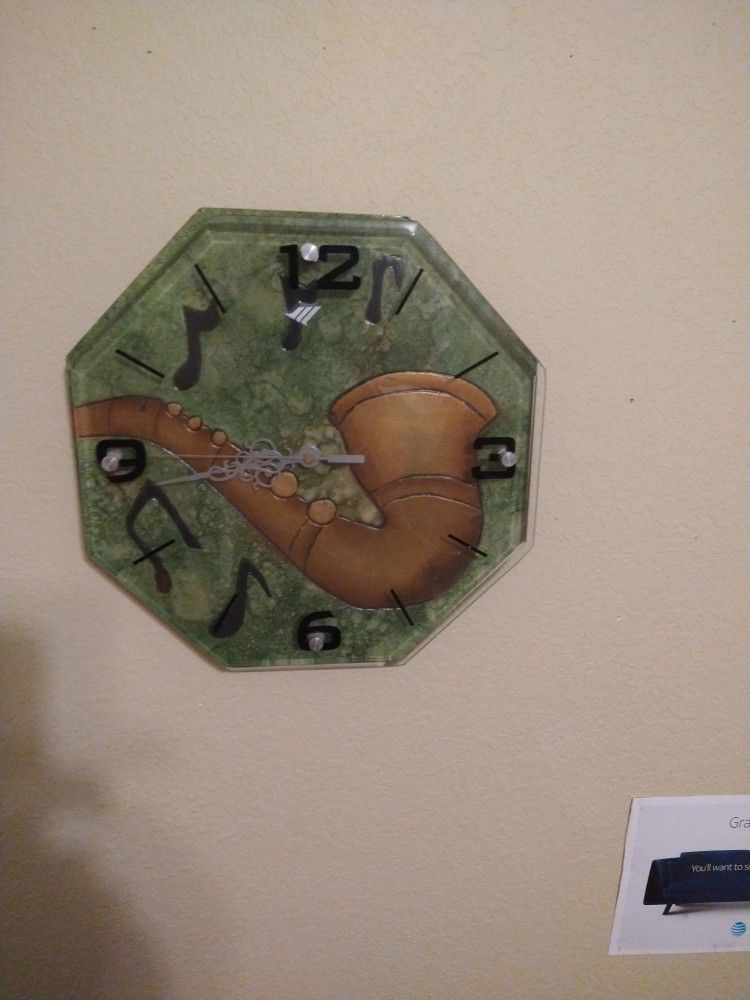 sax. clock. glass face. works. great. AAA battery.