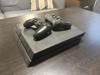 PlayStation 4 with two controllers