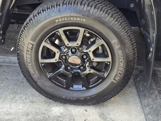 Toyota Tundra TRD OEM black rims with Michelin LTX A/T2 .