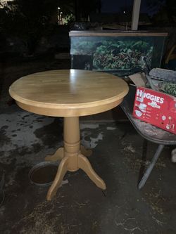 Wooden tall table with cast iron chairs