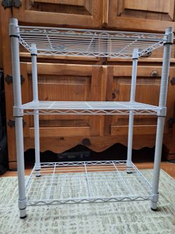 3 tier  metal shelf rack- holds up to 250 pounds per shelf