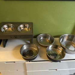 Used Dog Bowls Plus A Free Cracked Bowl On Thee Outside Only.