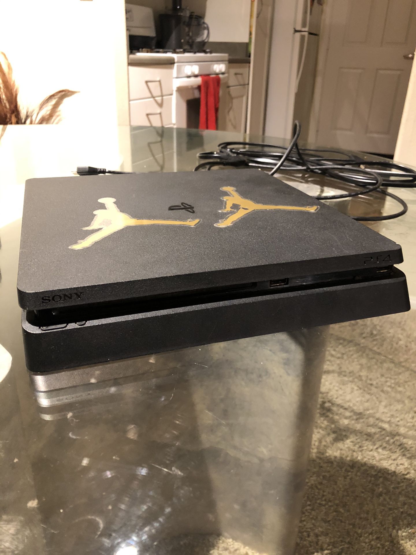 PS4 Slim with three ps4 games and a ps3 game