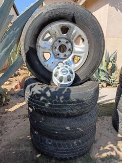 Nissan OEM Titan/Armada Rims & Tires w/ Center Caps $100 obo