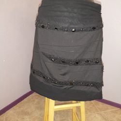 Black medium twenty one skirt with beaded accents 
