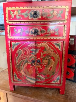 red lacquered Asian-inspired small cabinet