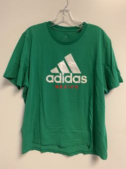 The Adidas Originals Mexico T-Shirt in Men's Size XL is a green short sleeve shirt made of cotton with a graphic print of the Adidas Trefoil logo. It 