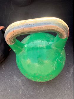 green, cast-iron Rage Fitness competition kettlebell  24 kilos 52 pounds