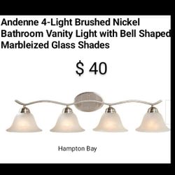 Brand New Hampton Bay Arden 4 Light Bushed Nickel vanity Light With Bell Shaped Glass Shades