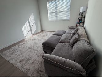 Very Comfy Grey Couch, Bundle option: includes area rug and shelf lamp