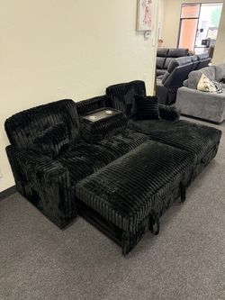 Black corduroy sleeper sofa with storage chaise