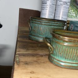 Two Copper Built Containers With Candle Wax Filling