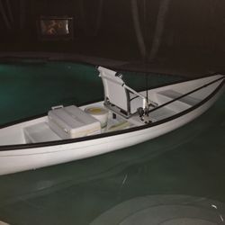 12’ American Eagle flat back canoe, motor, and trailer.