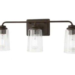 Hampton Bay Evangeline 23 in. 3-Light Modern Bronze Farmhouse Bathroom Vanity Light with Clear Seeded Glass Shades
