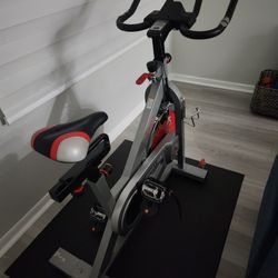 Sunny Health & Fitness Stationary Exercise Bike Machine w/ Adjustable Cushion Seat & Multi-Grip Handlebar