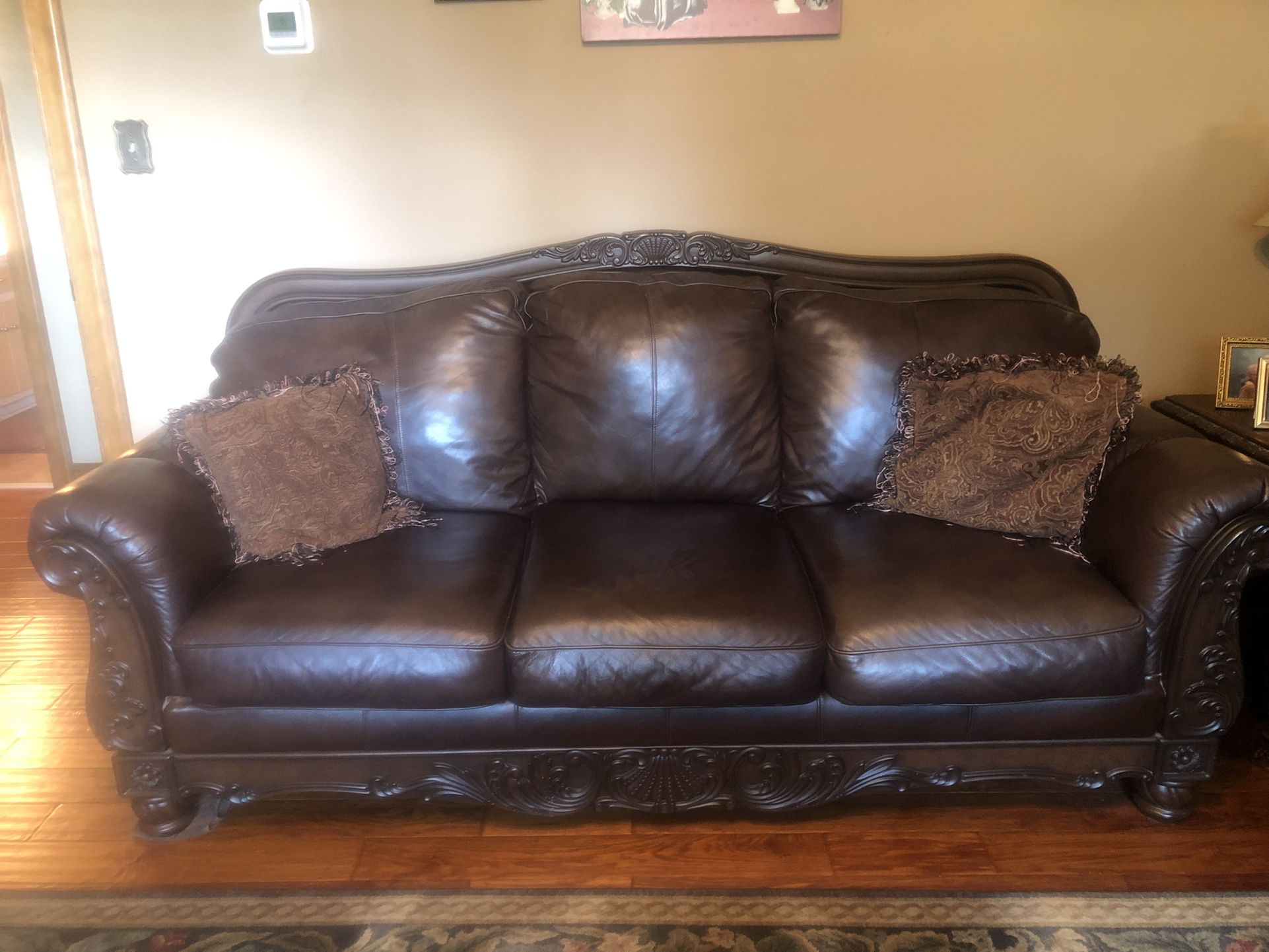Dark brown leather Couches and two end tables