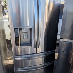 LG 4 door refrigerator/3 months of warranty and free local delivery