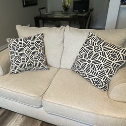 Cream Color Loveseat with Pillows