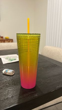 pink and yellow starbucks cup