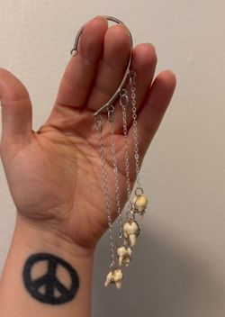 Handmade wire wrapped raccoon tooth ear cuff earring
