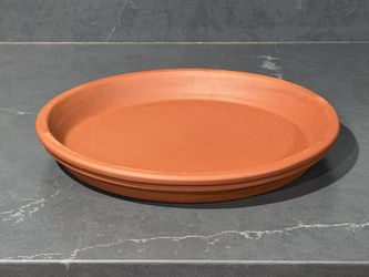 Terracotta plates/ saucers