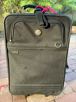 This Black Colored Rolling Pull Luggage Is Titled”Olympia” As the Brand.