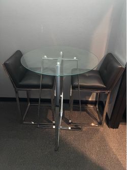 Glass and chrome bistro table with barstools