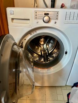Kenmore washing machine front load works fine new pump