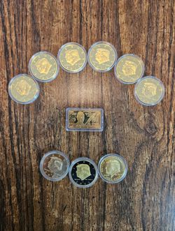 Estate Sale 10-Piece Donald Trump Gold-Tone Commemorative Collection – 9 Coins & 1 Gold Bar