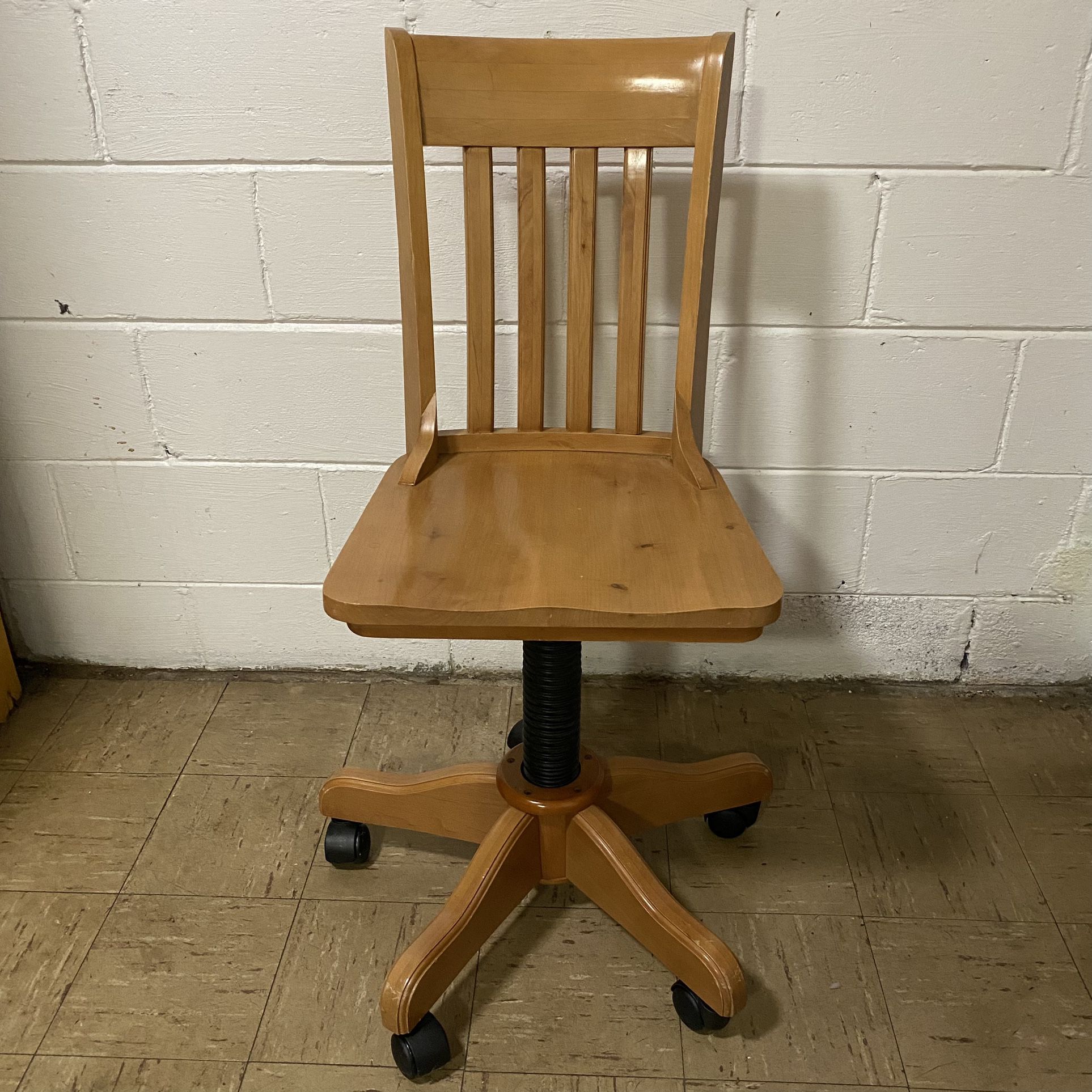 Vintage Solid Wood Swivel Office Chair with Adjustable Height  Great pre-owned condition.   Brand: Bombay Kids (even though it fits an adult)  Pick up