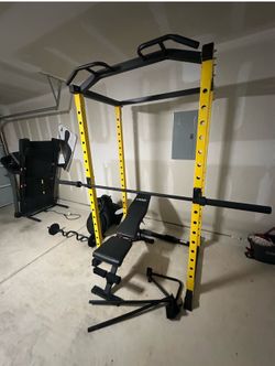 Weightlifting gym rack with seat and bar and weights