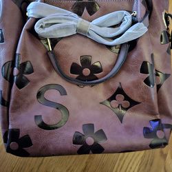 Large purple and black purse brand new three sizes of straps to wear seen all over tick tock