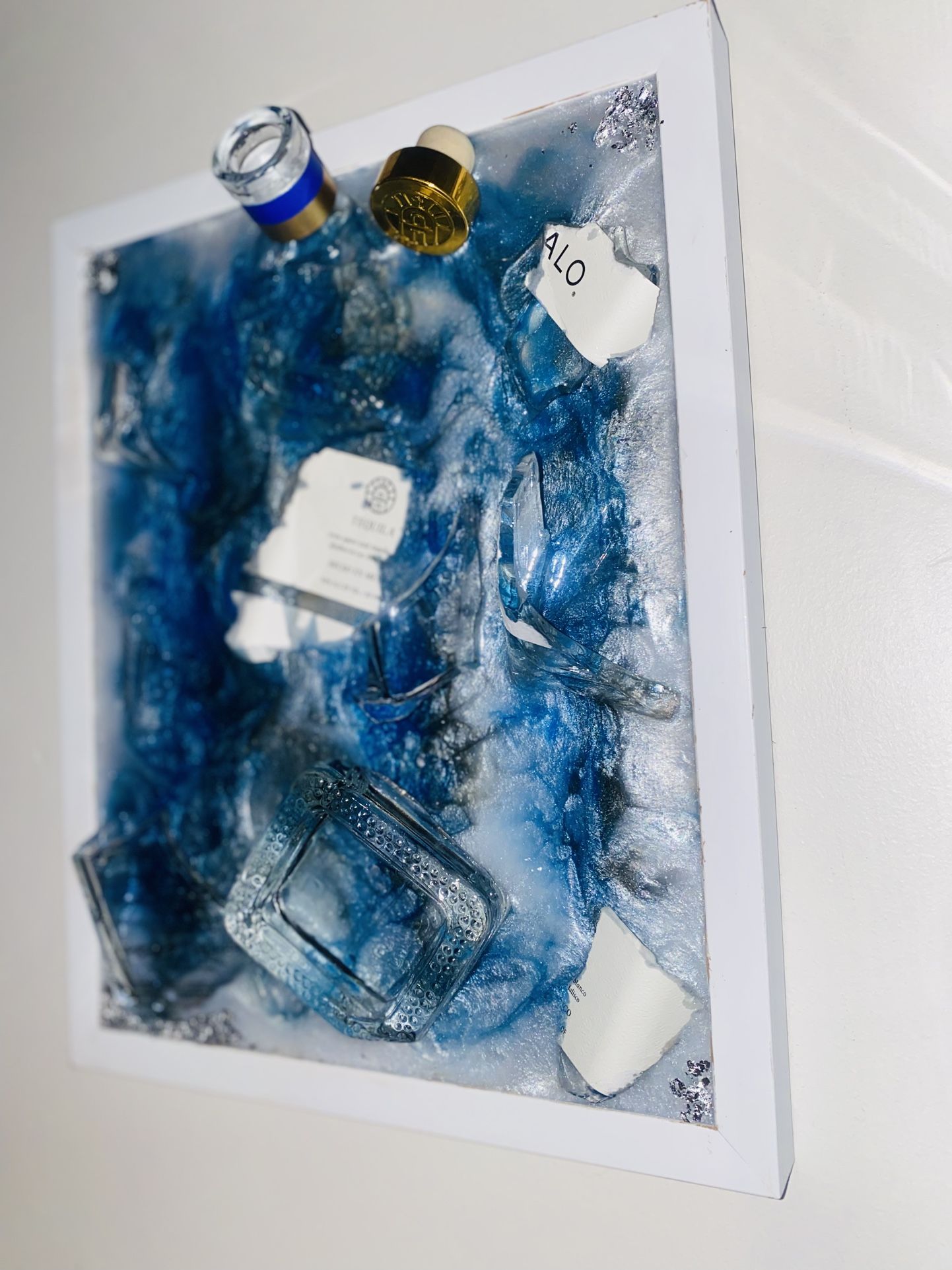 Handmade custom epoxy decor featuring a bottle of Hennessy