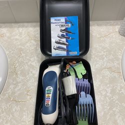 Wahl cordless electric hair clipper .
