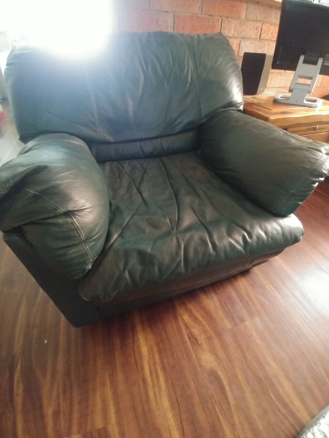 Green overstuffed chair + ottoman