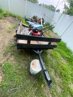 Black Utility Trailer with Wood Side Rails