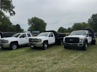 Selling Various Dump Trucks pickup Trucks Crew Cabs Duramax PowerStroke Diesel Vortec GMC 3500HD F450 F250 Lariat 