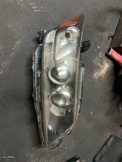 Head light passenger side oem Authentic scion tc2012
