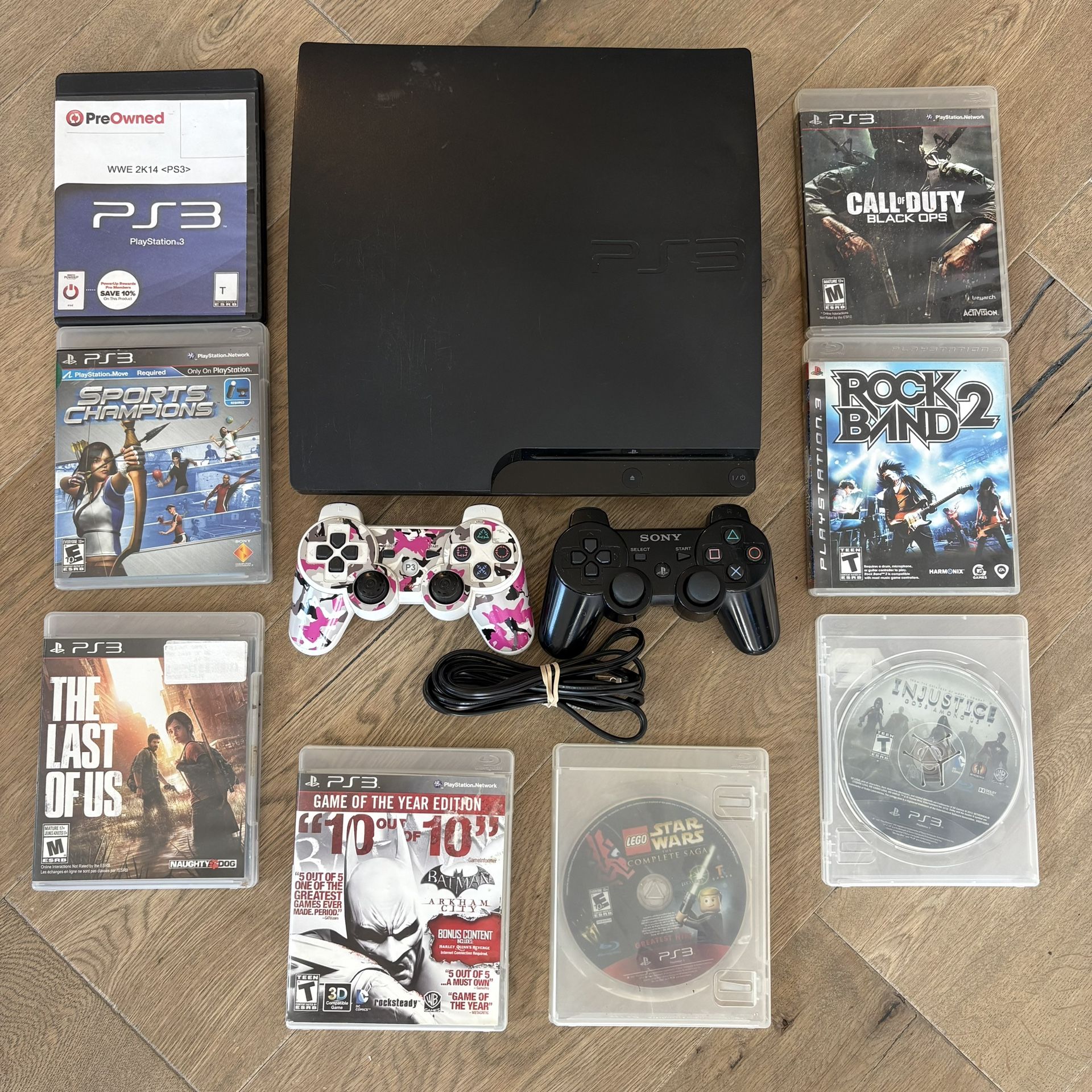 PS3 With 8 Games And 2 Remotes