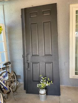Entrance Front double door solid - with frame / keys - 95 each long / 36 inches each door . Matte black color is exterior and white is interior of th