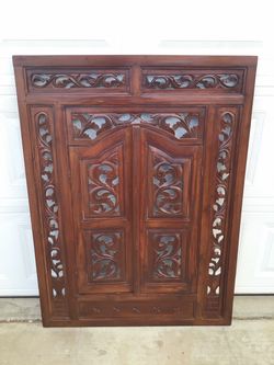 Hand-Carved Wooden Panel with Double Door Design