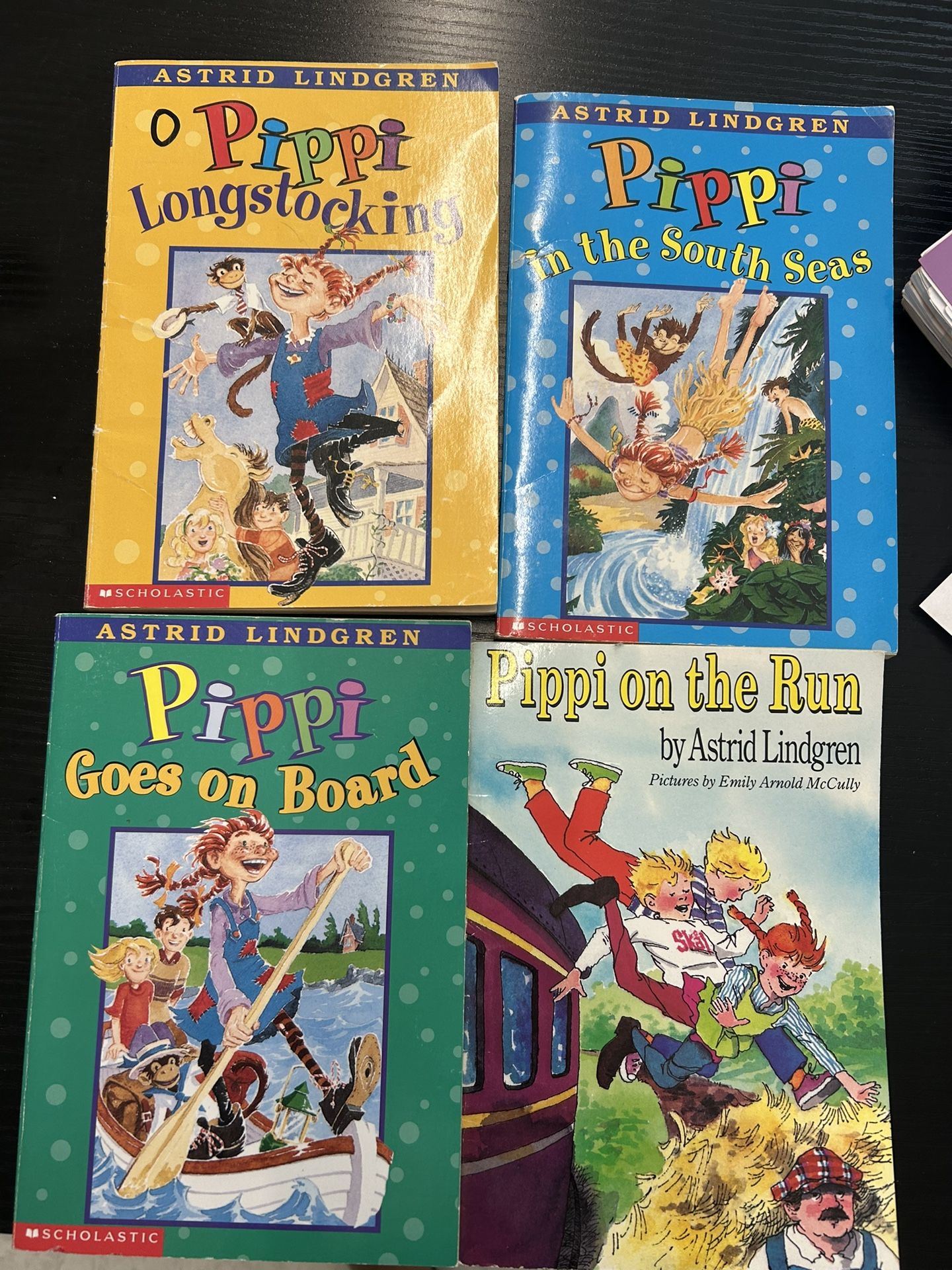 4 paperback children's books by Astrid Lindgren - "Longstocking in the South Seas", "Pippi Goes on Board", "Pippi on the Run", "Pippi's Adventures"