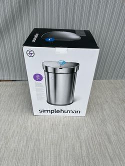 New in the box SimpleHuman 45L Semi Round Sensor trash can. Sealed in the bag trashcan