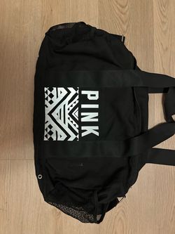 Pink small black duffle bag