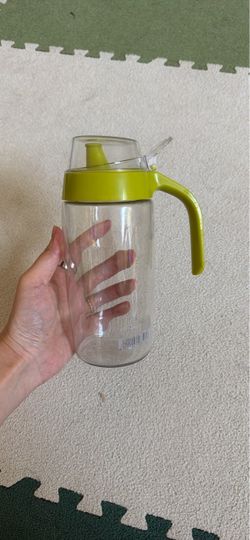 Clear Oil Dispenser with Green Lid