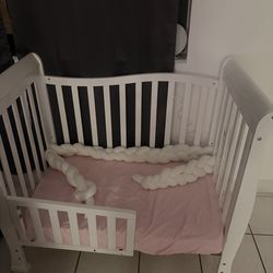 Mini crib turned into toddler bed