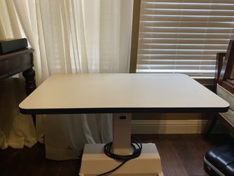 Medical equipment table/stand. Motorized.