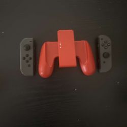 Grey Nintendo Switch Joycons With Red Controller Grip